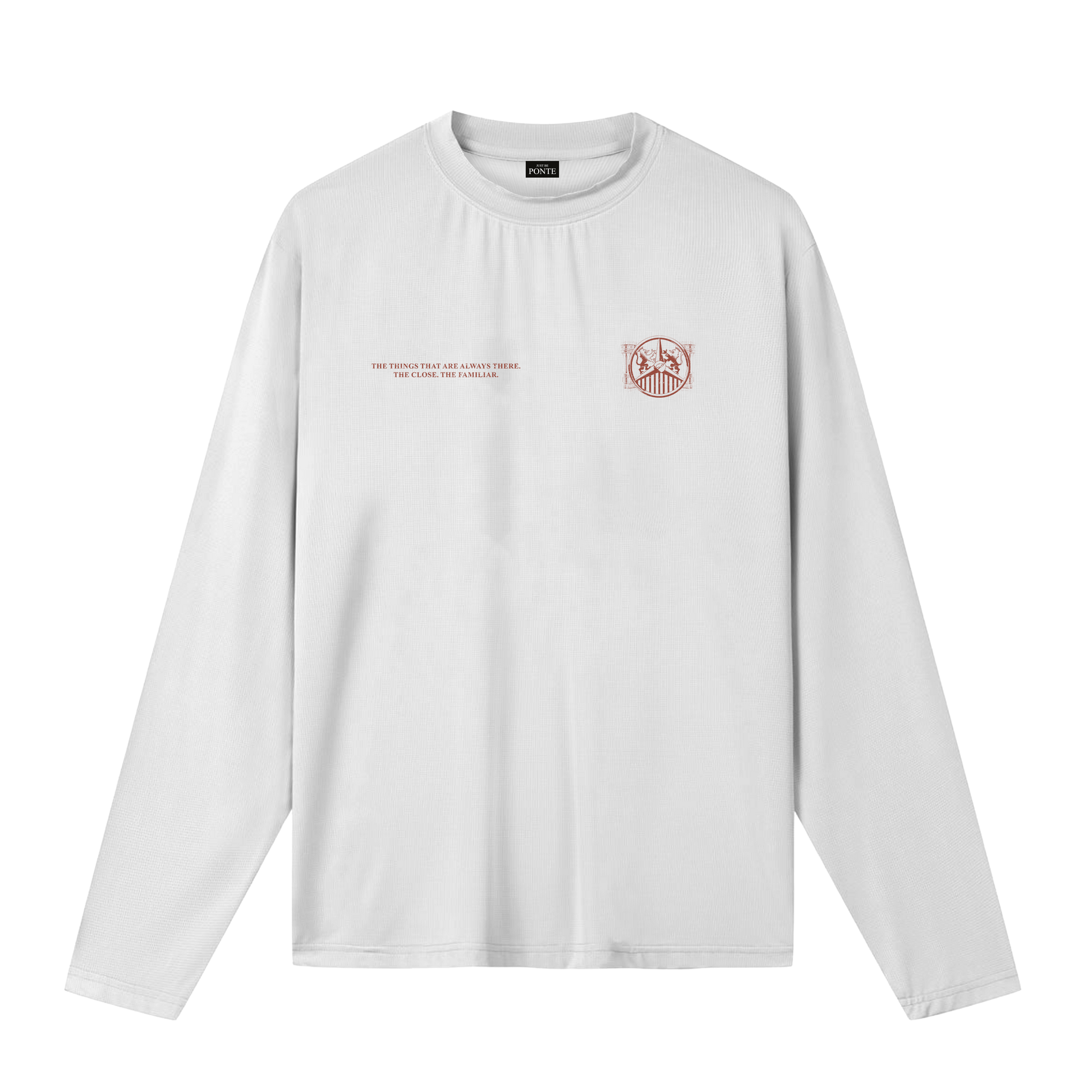 Camiseta manga larga Our Culture blanca, vista frontal con texto y escudo terracota sobre el pecho